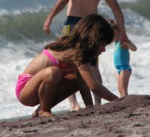 Girl playing in the sand
