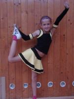 pretty tween cheerleader squat