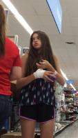 12yo Brunette with an injured hand at the store