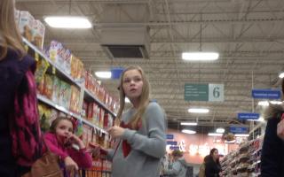 11yo blonde in black leggings at grocery