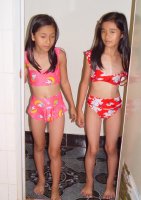 2 Vietnamese Preteens Take Bath in Bikinis