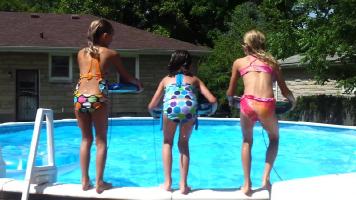 Three Very Cute Little Girls In A Pool