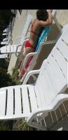 Teen in red bikini at the pool