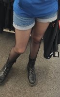 Young girl working in a clothing store - Pantyhose   denim short